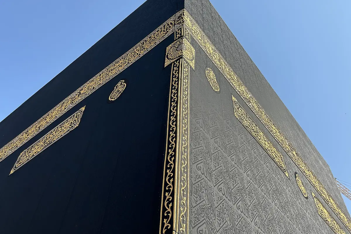 The Kaaba draped in its black Kiswah cloth during daytime at Masjid al-Haram Makkah