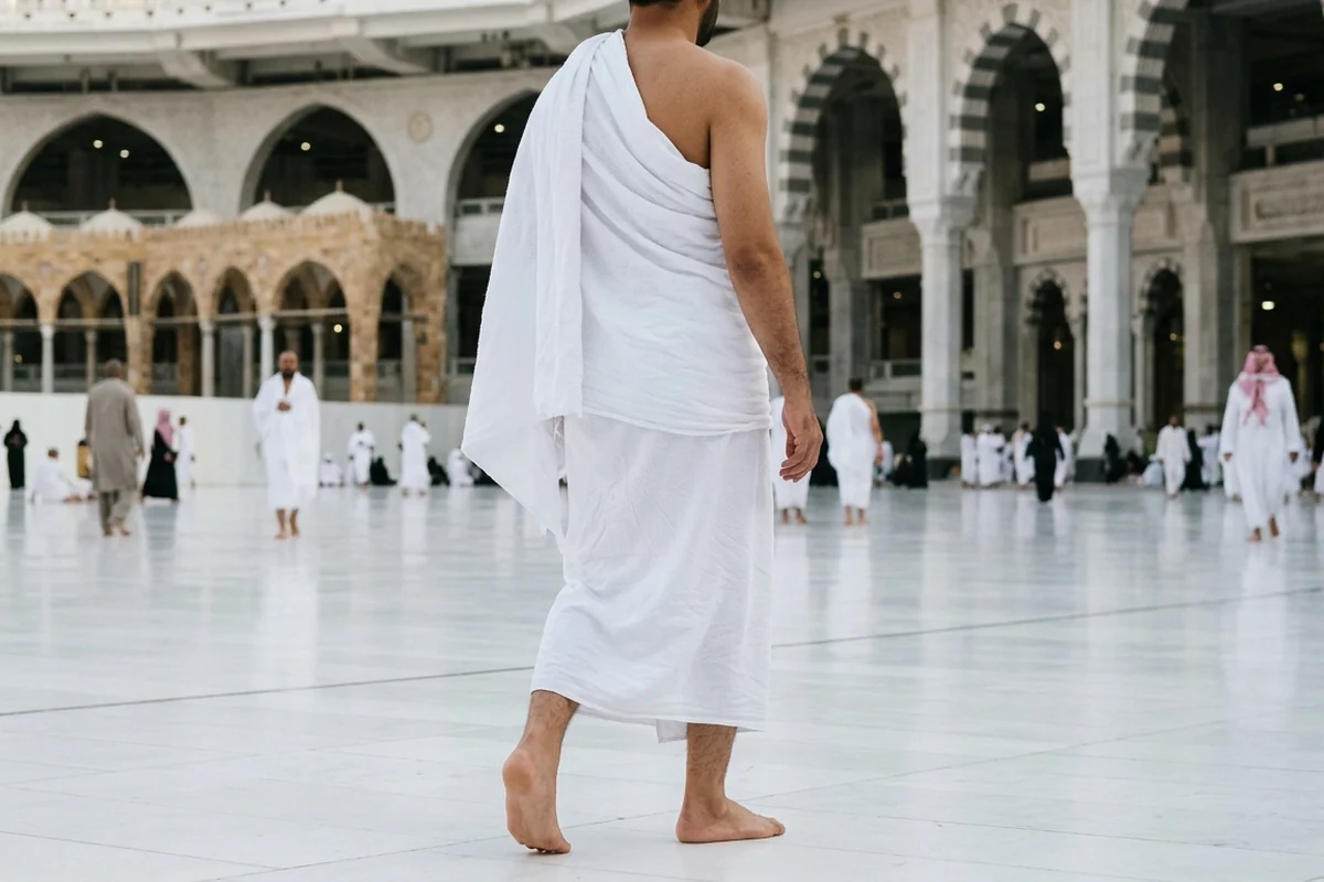 Pilgrim in white Ihram garments at Masjid al-Haram