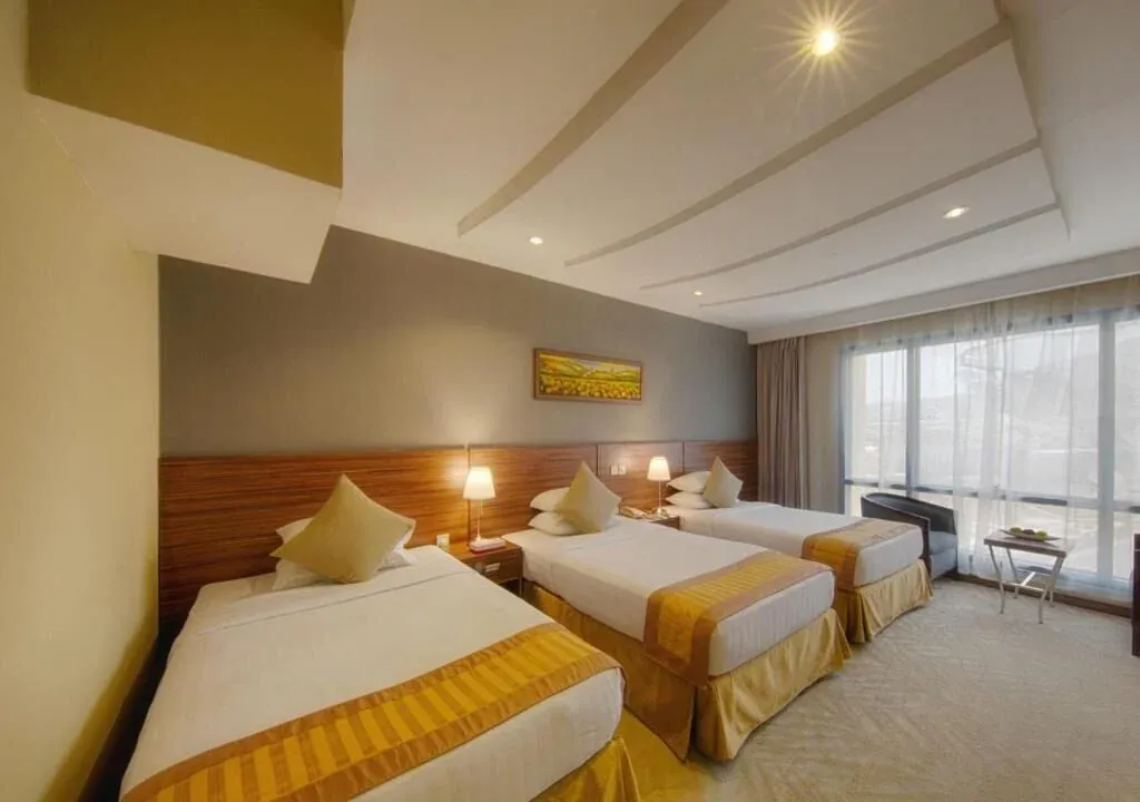 Standard Triple Room Side Haram View at Al Safwah Royale Orchid Hotel Makkah
