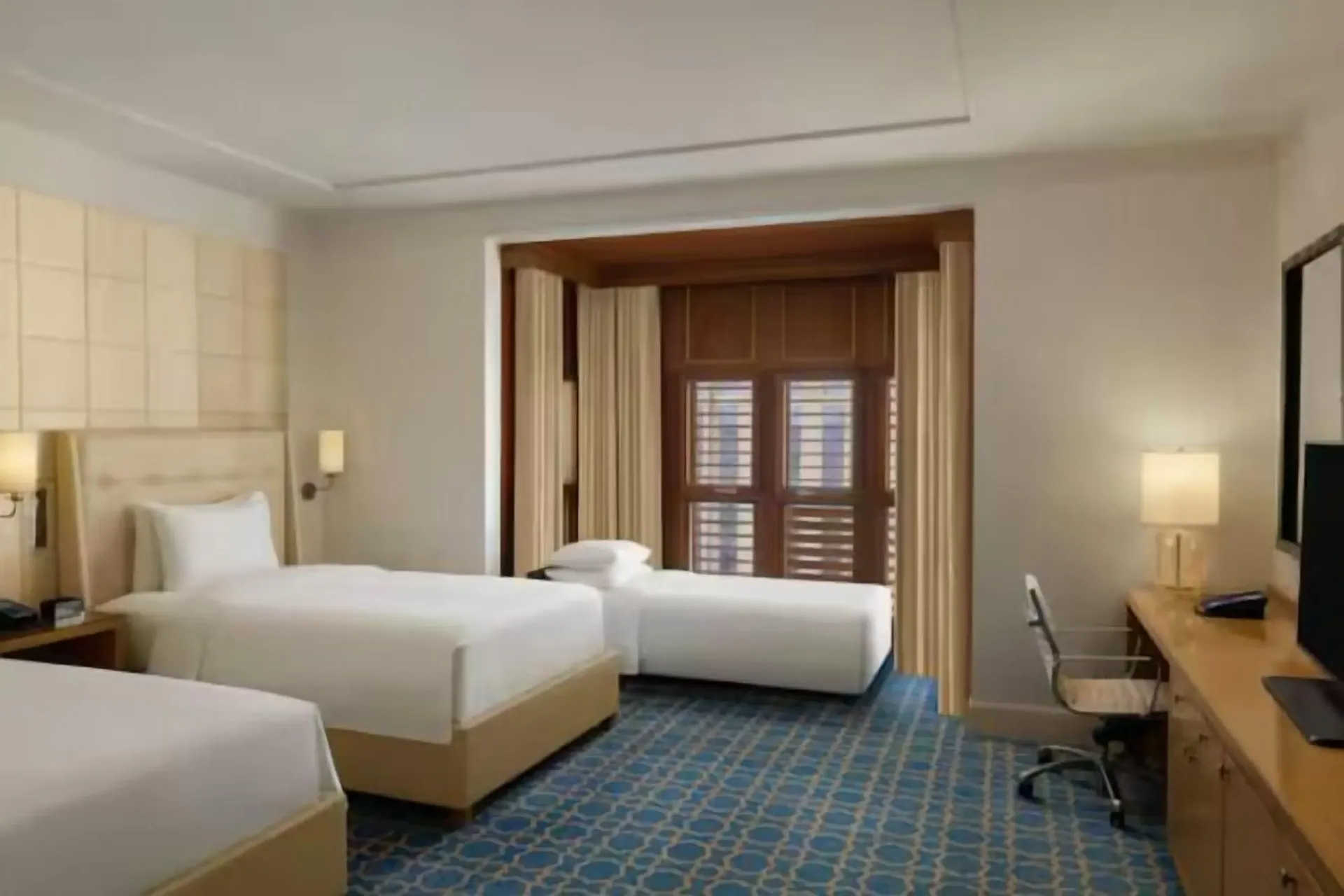 Three Single Beds Guest Room at Hilton Hotel & Convention Jabal Omar Makkah