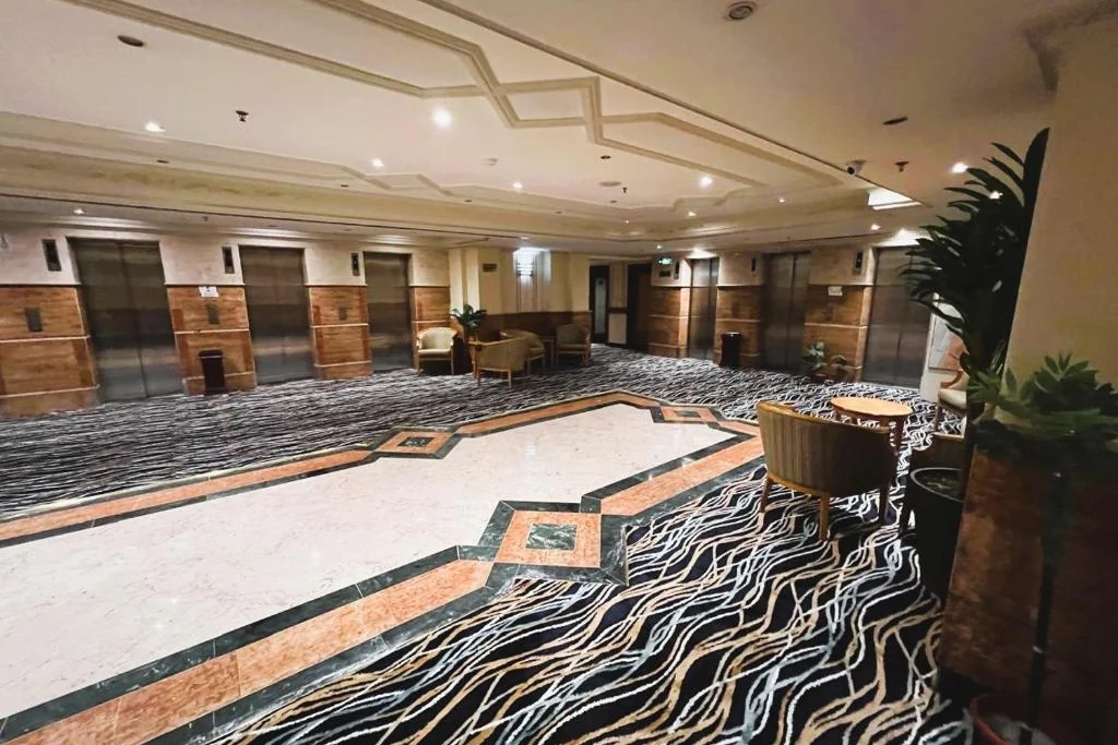 Lift lobby and seating area at Maysan Al Maqam Hotel