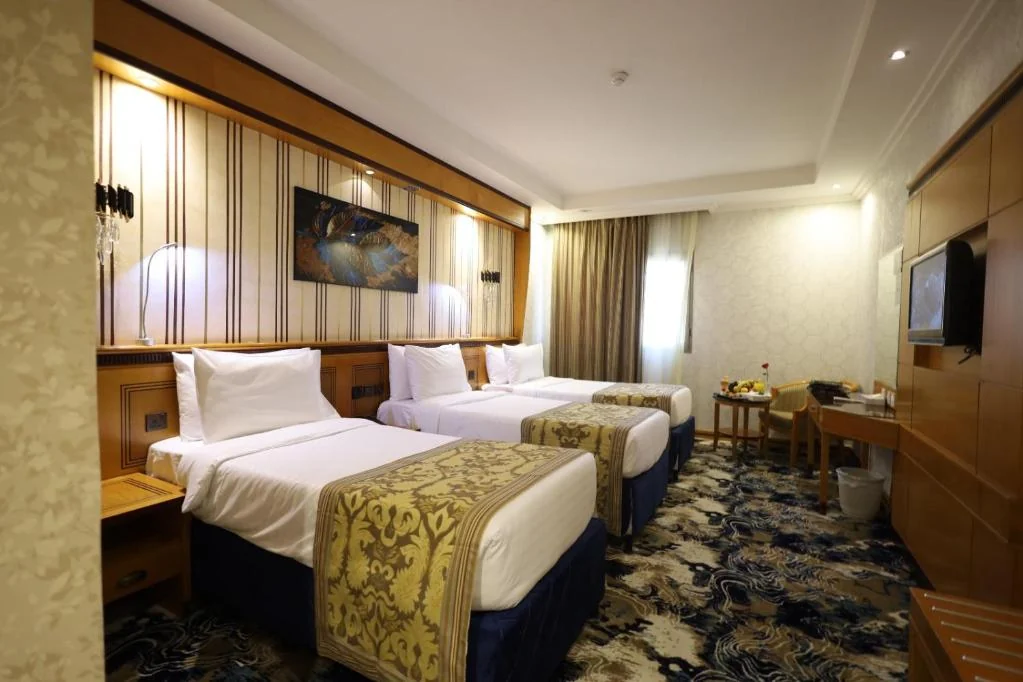 Triple room with three beds at Maysan Al Maqam Hotel