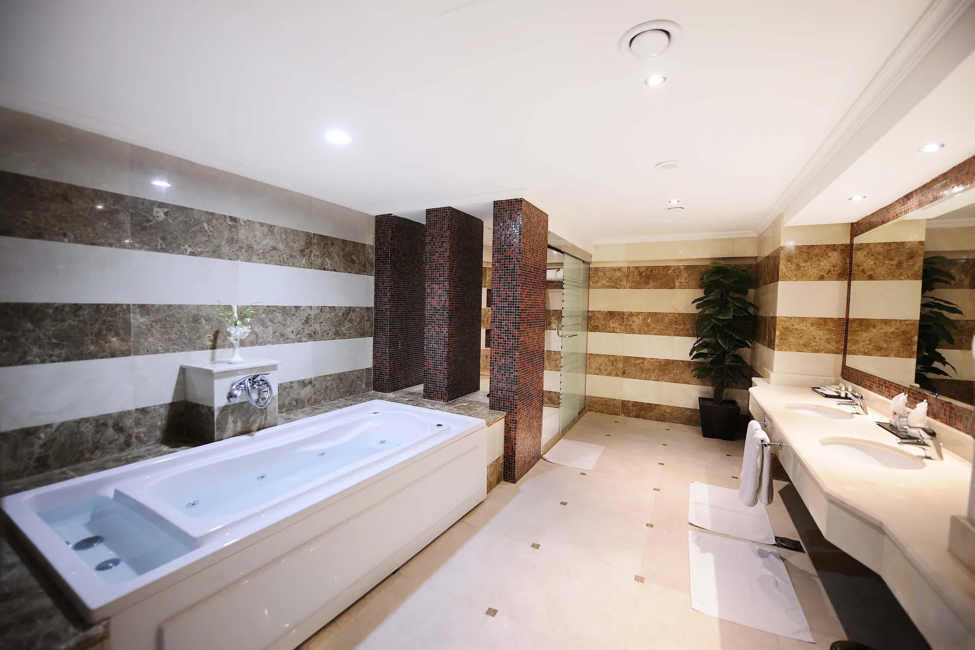 free toiletries, hair dryer, slippers, Deep-soaking bathtub at Millennium Al Aqeeq Hotel