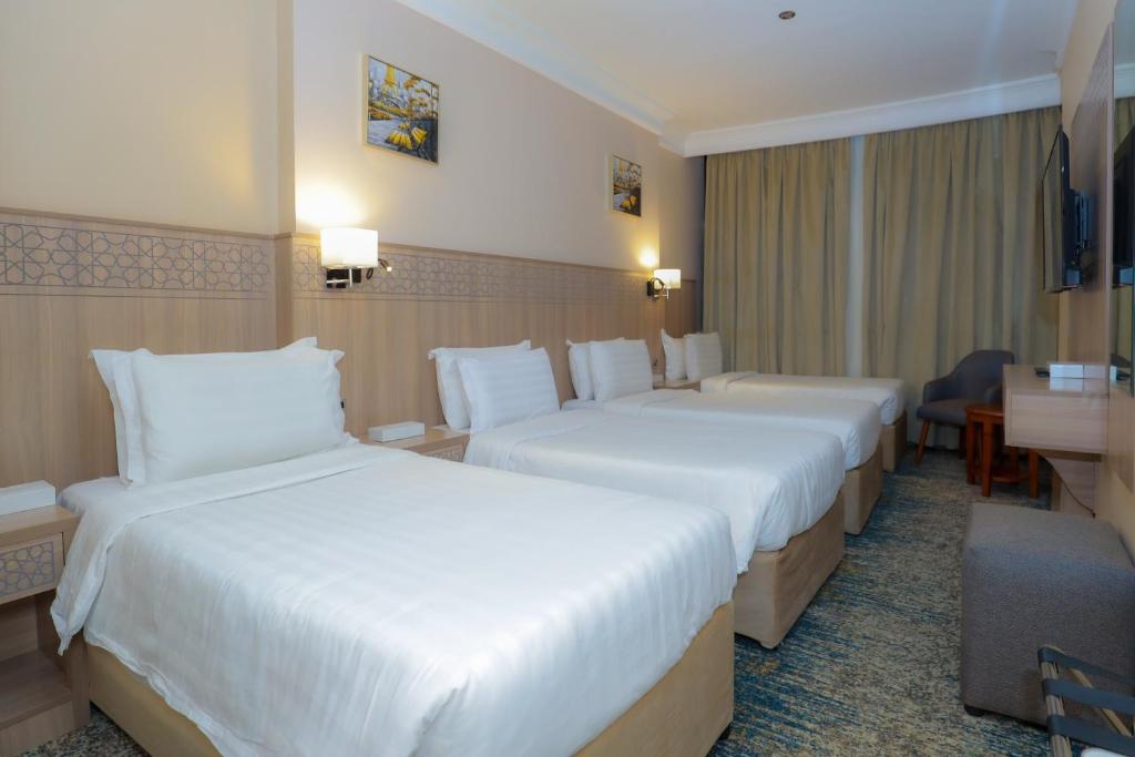 Quad room with four beds at Nawazi Towers Hotel